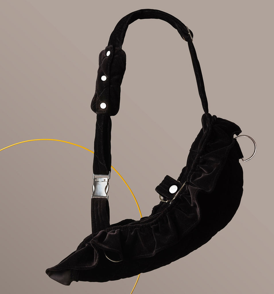 Luxury velvet arm sling with a detachable frill, designed for elegant evening wear. The velvet is quilted and the hardware is silver. The strap is soft and adjustable.