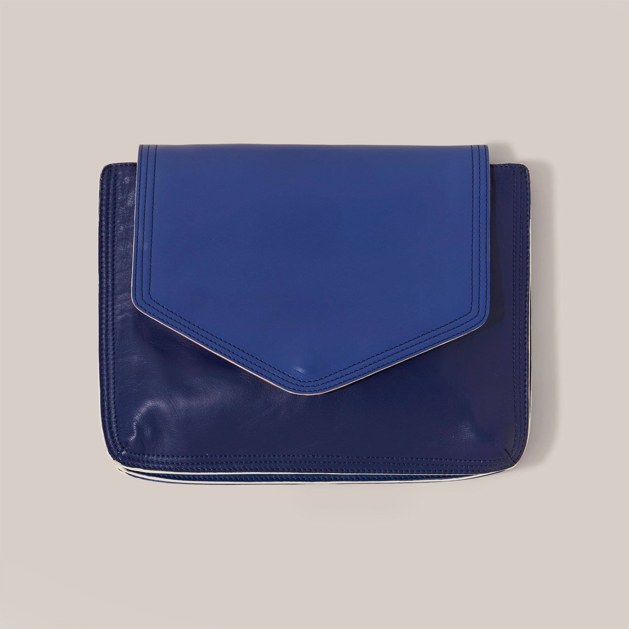Large blue leather document folio for notes and papers associated with patient journey such as consultant notes, hospital appointments and health insurance documents. This a product shot of the folio.