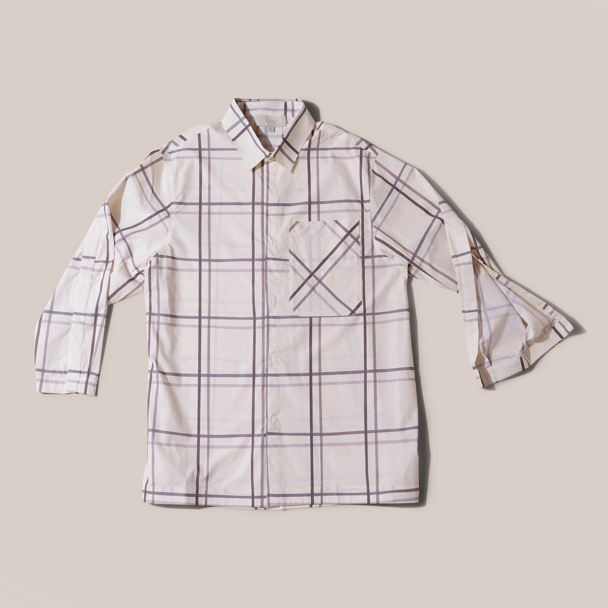 Product shot TONIC Mens Noah Long sleeve in Silver Linings. Clinician-approved adaptive pyjama set with discreet popper front openings for easy medical access during hospital stays. Designed to be worn with a catheter if needed and ideal for those with low dexterity or dementia. Soft, breathable cotton with short sleeves and adjustable drawstring waist for comfort and dignity in recovery. With deep cuff open to expose arm for bloods and blood pressure.