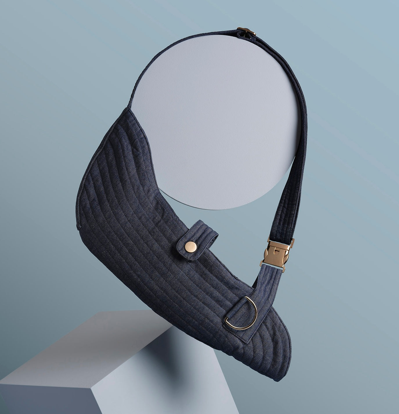 Stylish denim arm sling for arm support and injury recovery, featuring a comfortable, adjustable strap and durable fabric design for added stability and comfort.