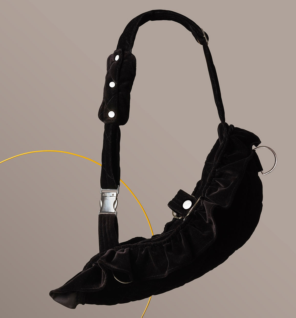 Luxury velvet arm sling with a detachable frill, designed for elegant evening wear. The velvet is quilted and the hardware is silver. The strap is soft and adjustable.
