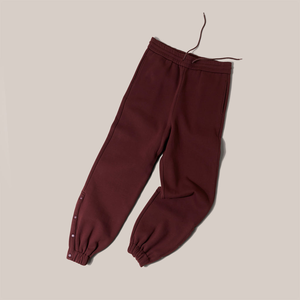Product shot of TONIC chemotherapy tracsuit bottoms with popper detail