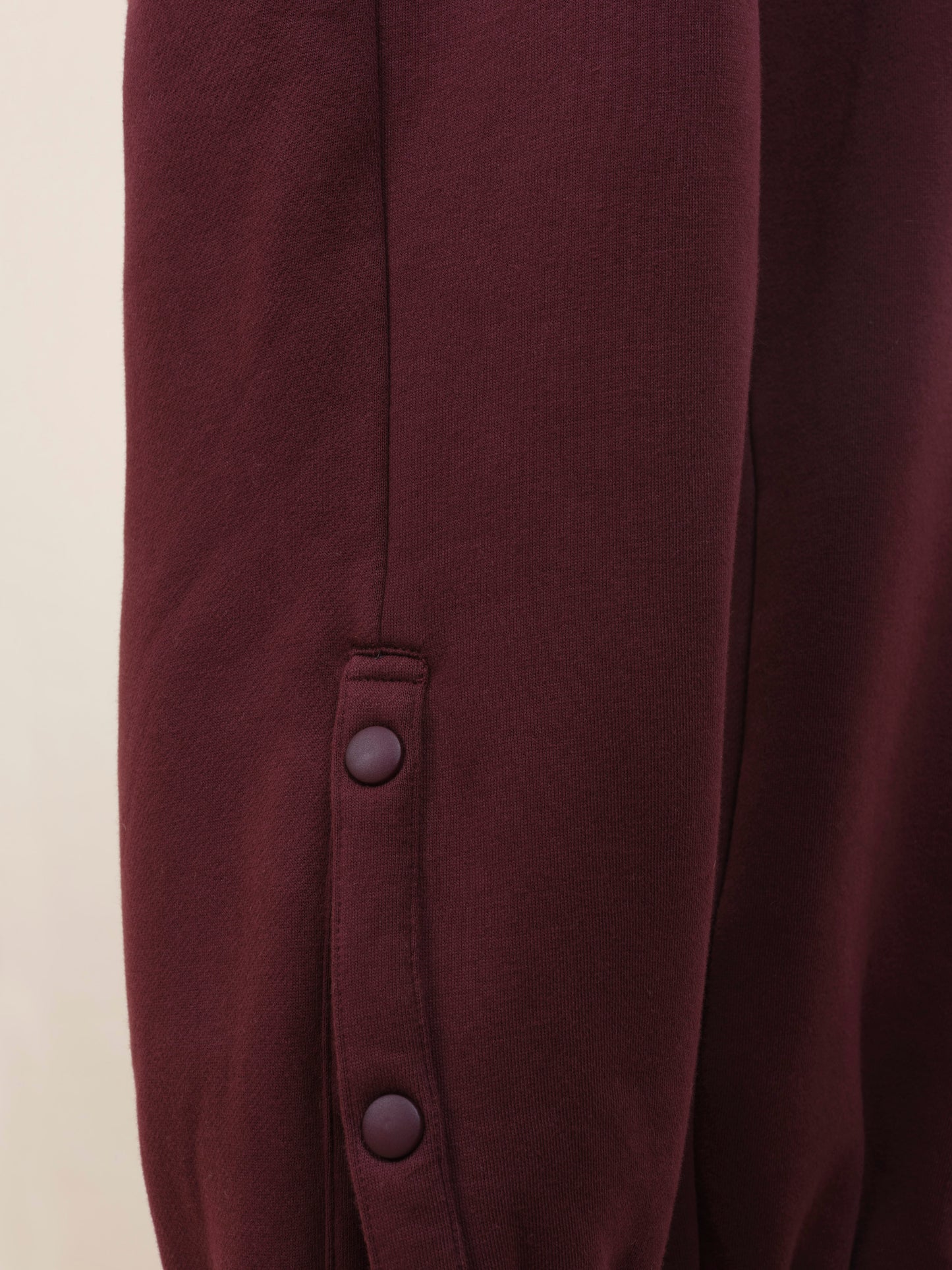 Popper detail of chemotherapy tracksuit from TONIC